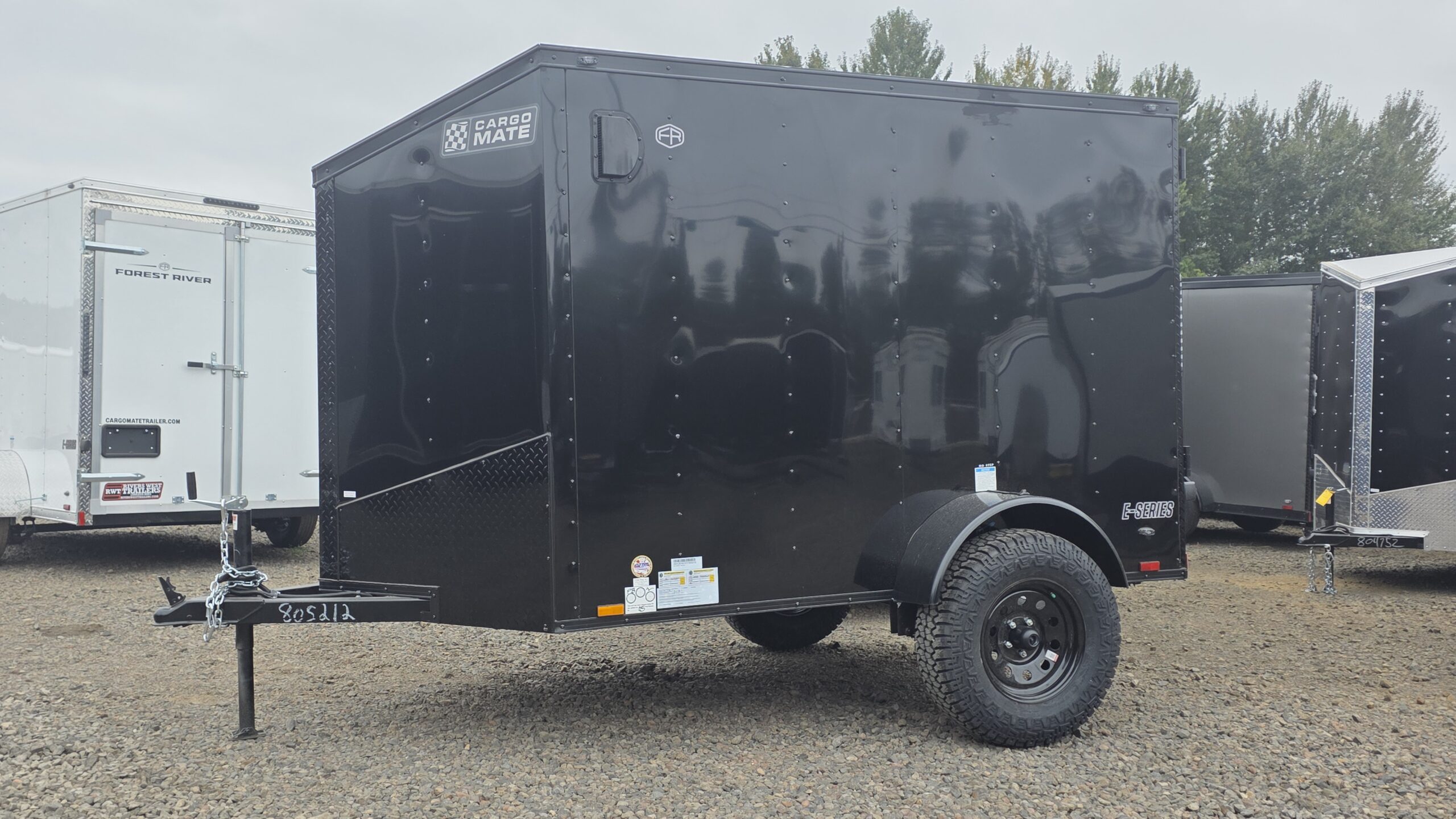 2026 Cargo Mate 5×8 Enclosed Cargo Tailer Extra Height Apex Tires Pure Black Straight Axle 4″ Lift