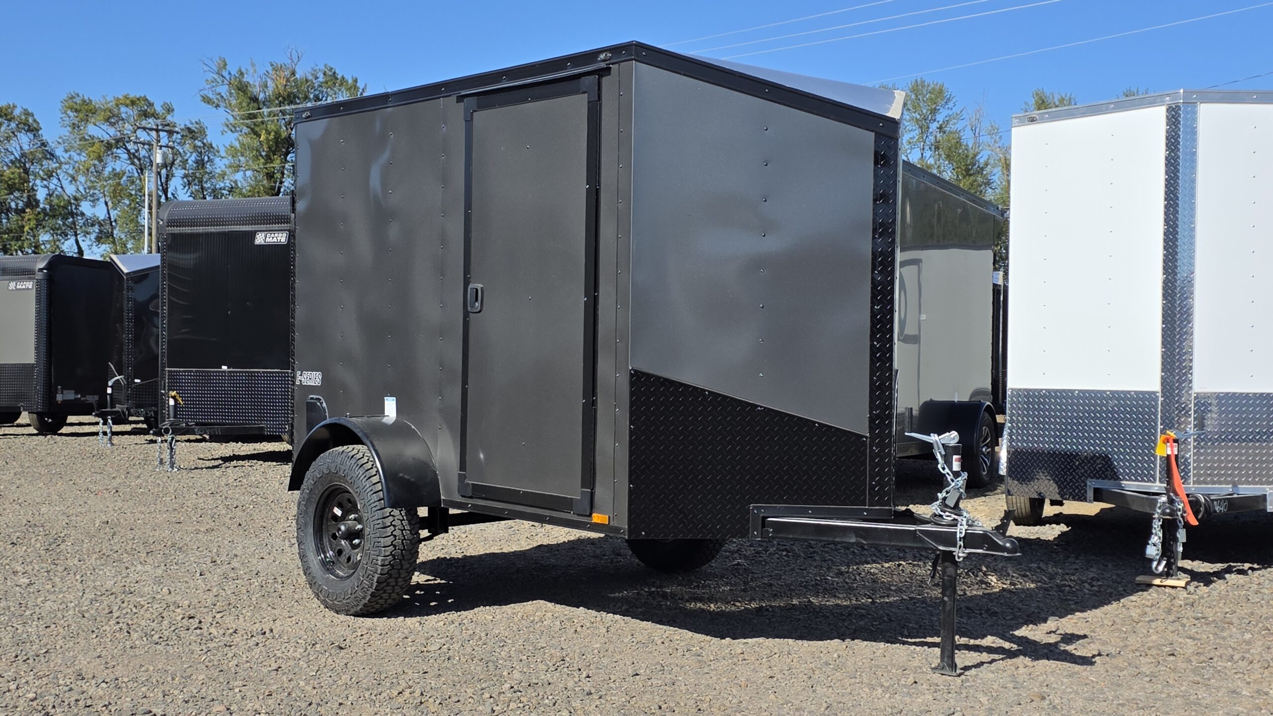 2026 Cargo Mate 5×8 Enclosed Cargo Tailer Extra Height Apex Tires Pure Black Straight Axle 4″ Lift